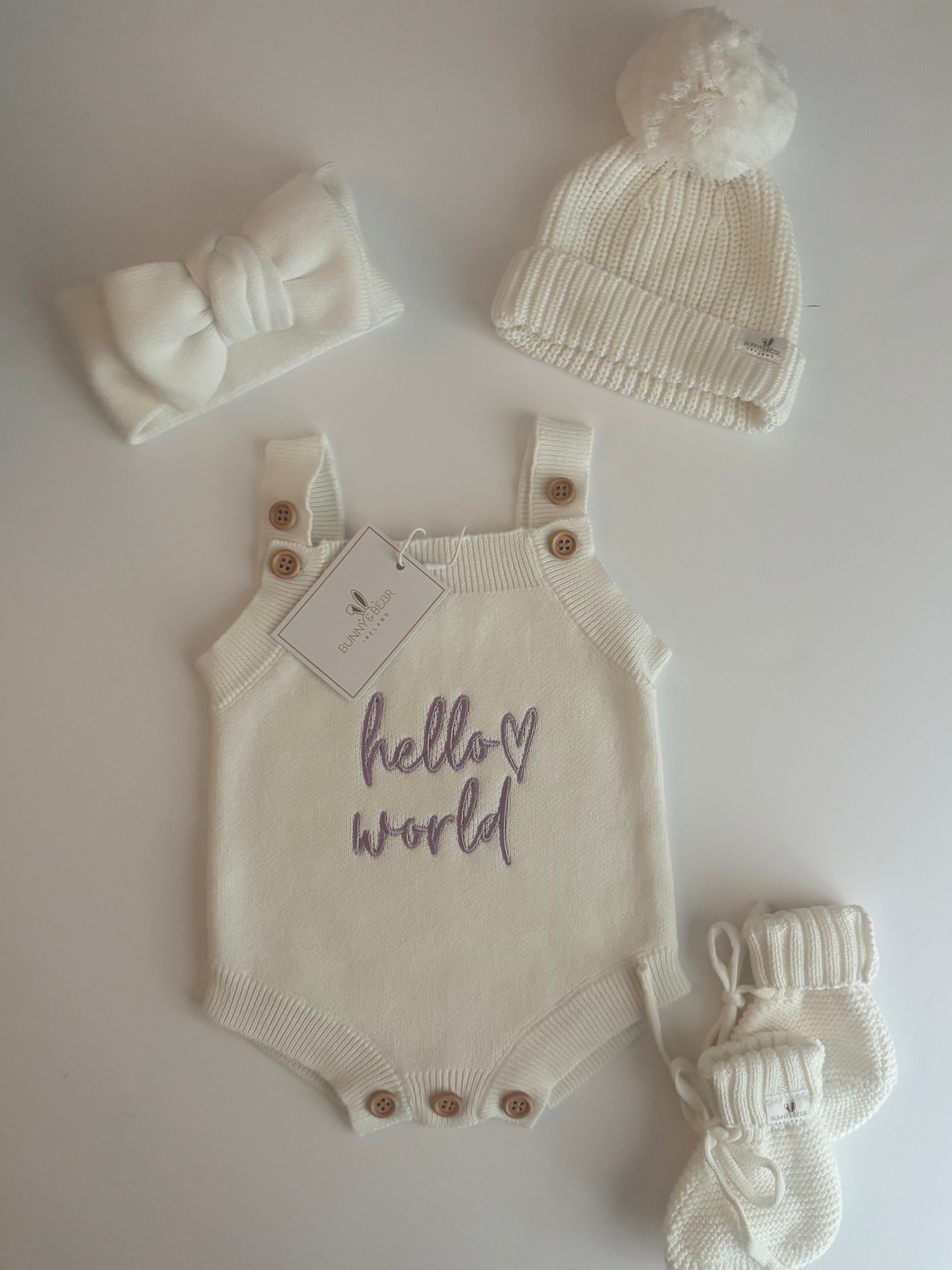 Baby outfit set with romper, hat, and booties